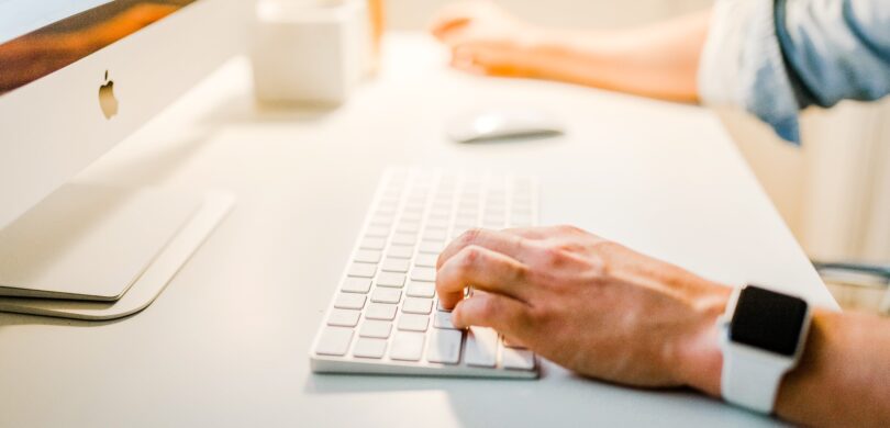 A person sitting in front of a computer.